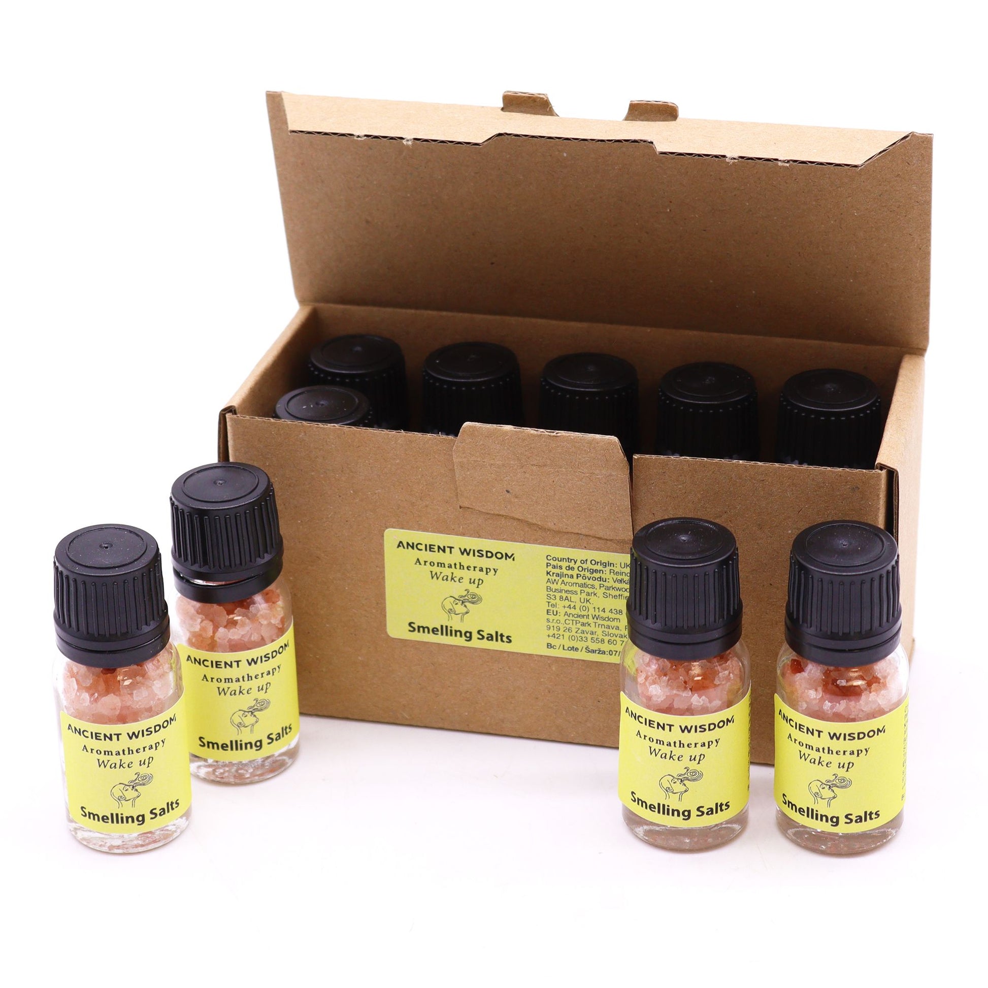 A box of Ancient Wisdom Wake Up aromatherapy smelling salts with pink crystals.