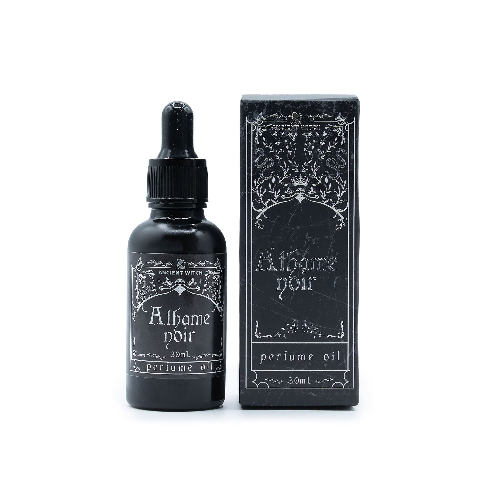 A black bottle of Athame Noir perfume oil with a dropper and its matching box.