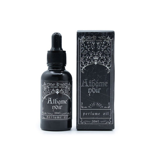 A black bottle of Athame Noir perfume oil with a dropper and its matching box.