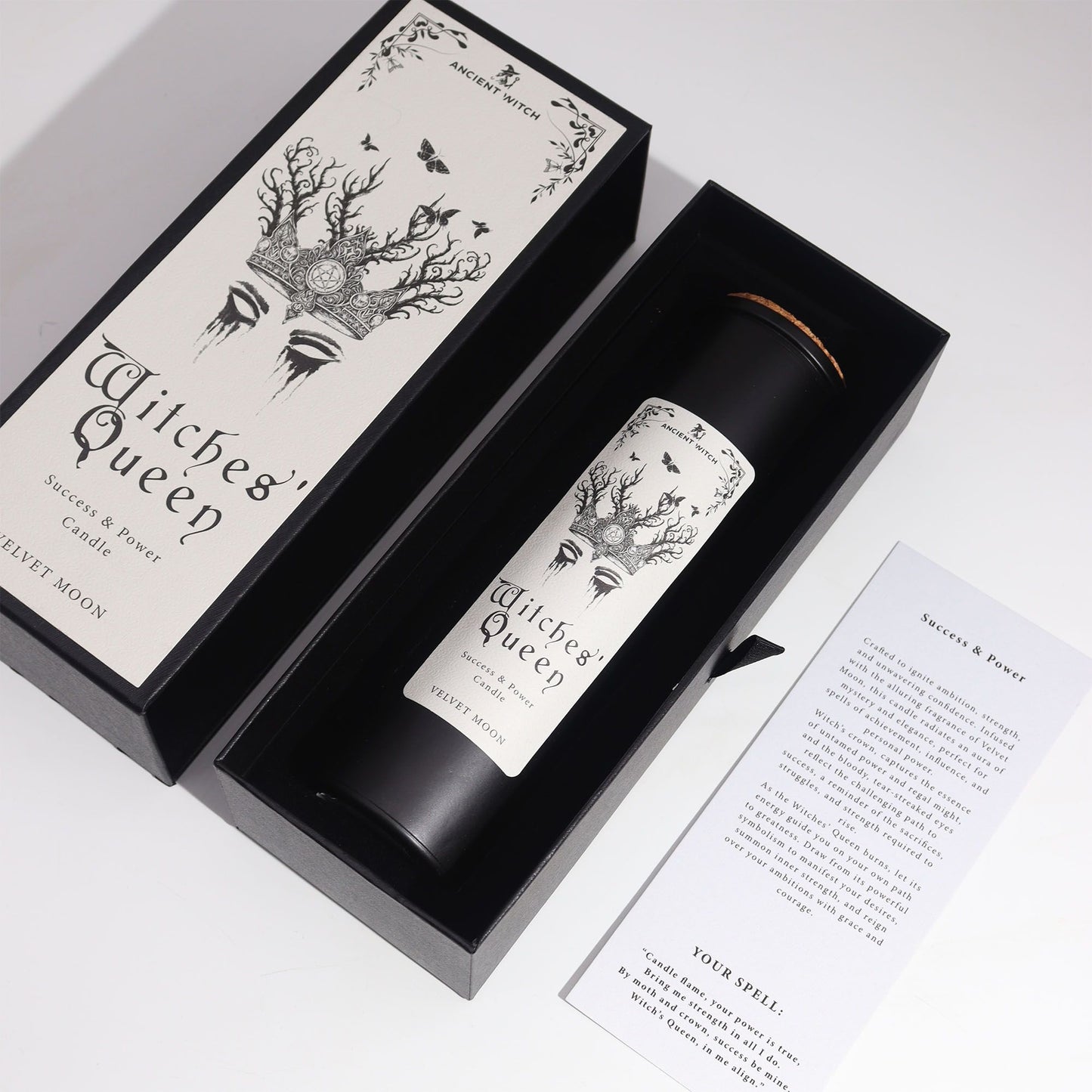 A black candle with a "Witches' Queen" label in a black gift box.