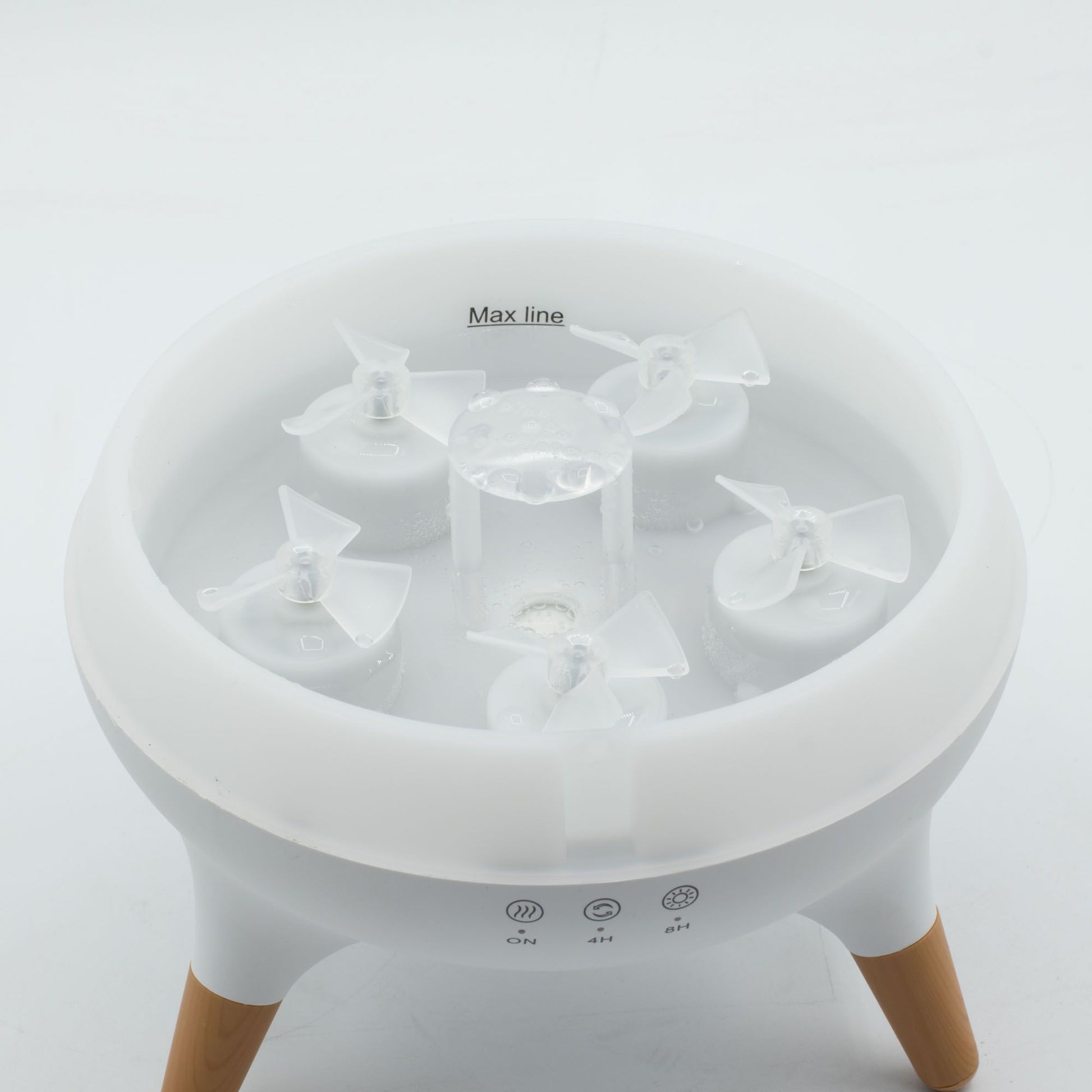 A white aroma diffuser with five mist outlets and wooden legs.