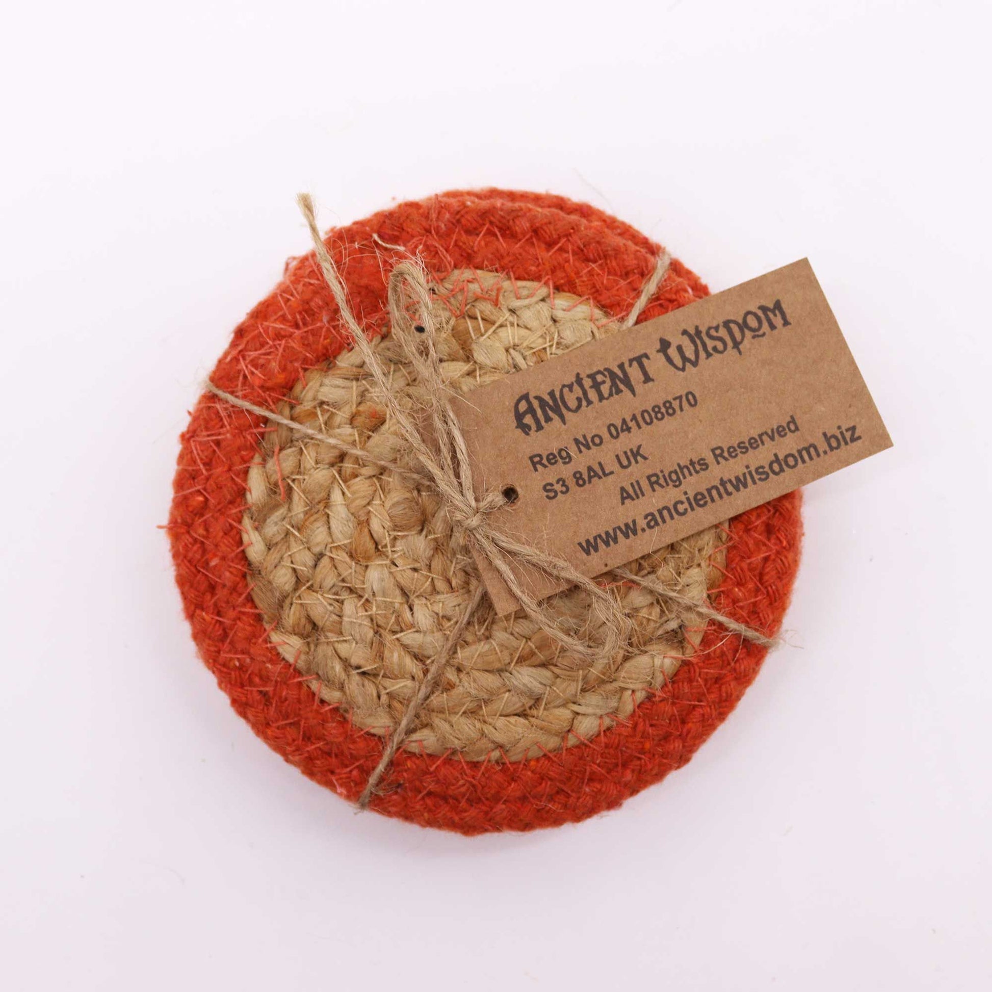Round jute and cotton coaster with orange border and brown tag.
