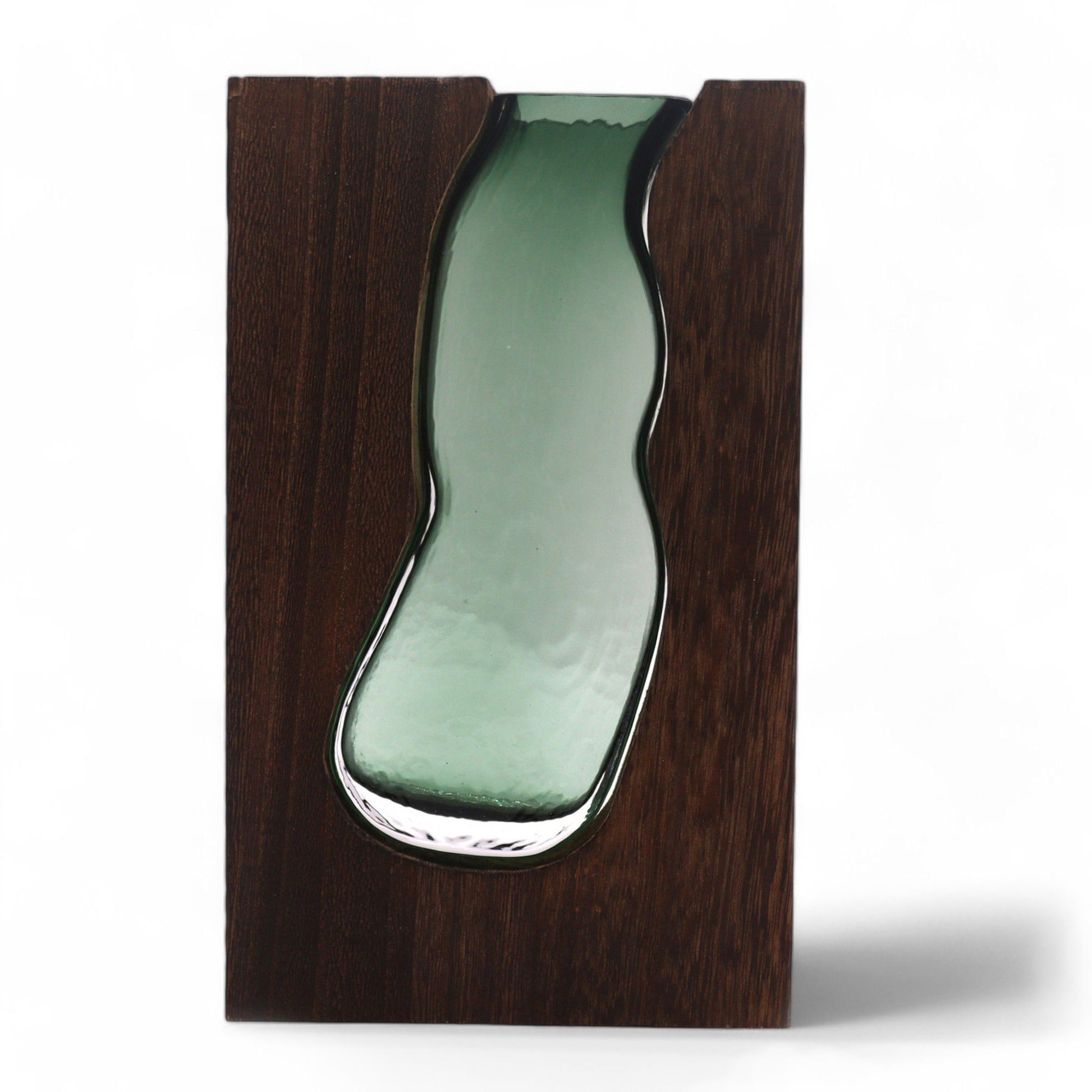 Glass vase with a wavy shape set into a dark wood rectangular base.