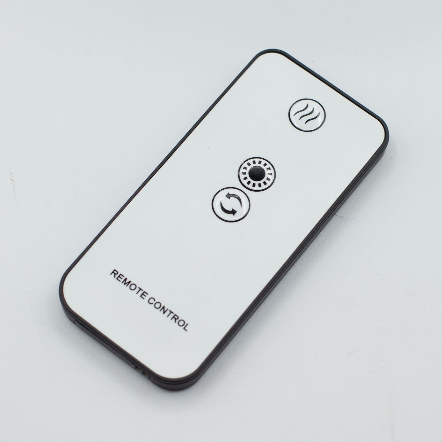 White remote control with heat, fan, and rotation icons.