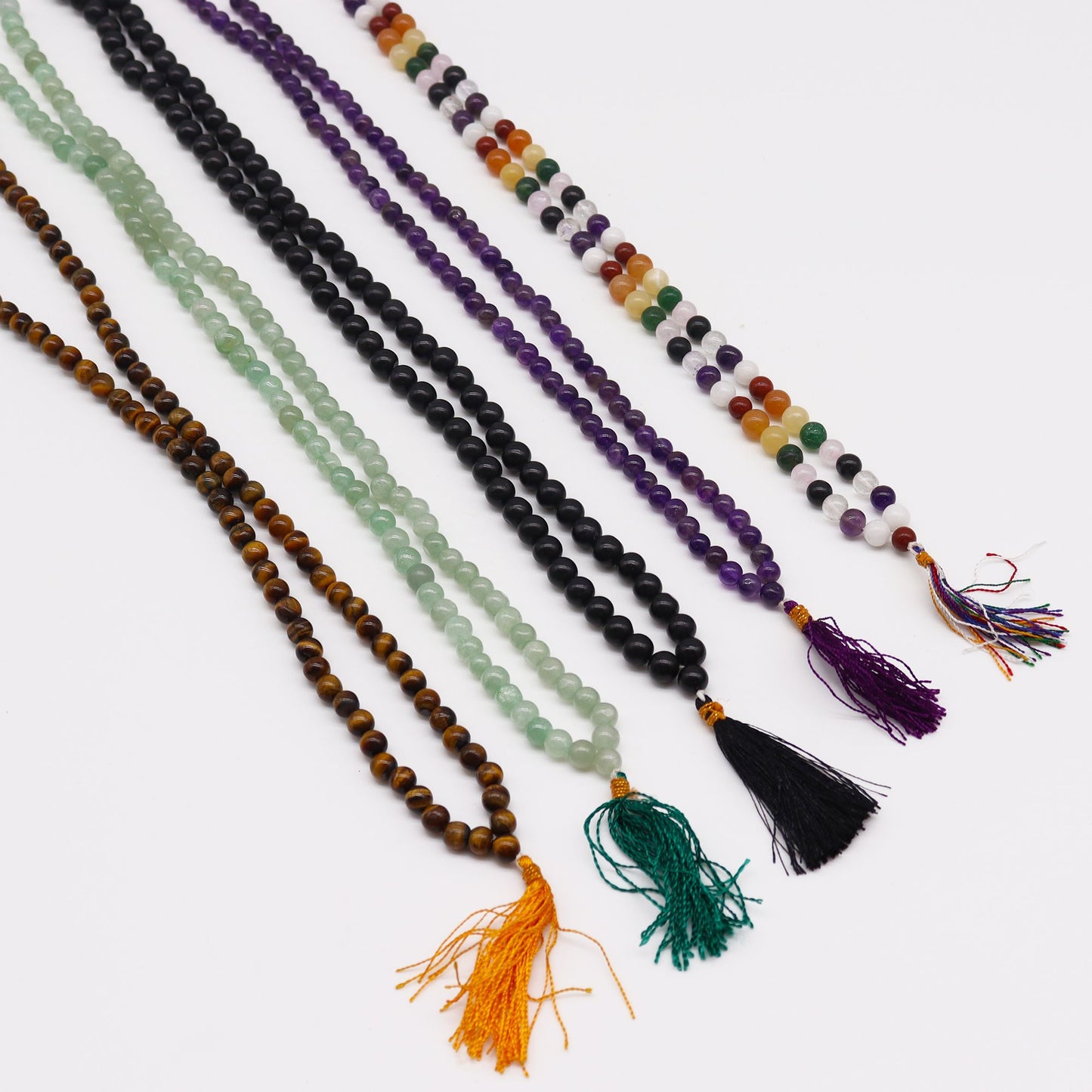 A strand of 108 amethyst beads with a purple tassel.
