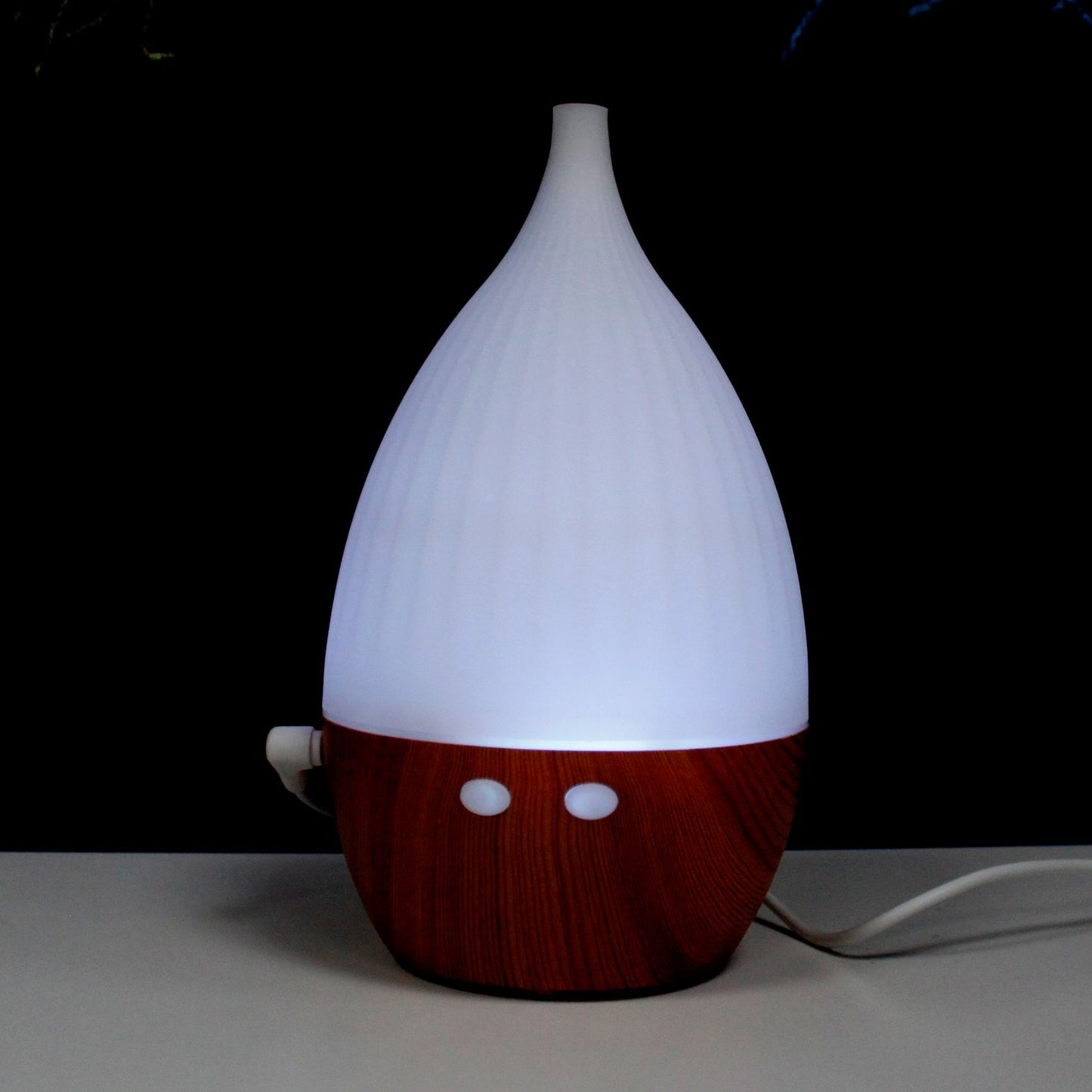 Milan Atomiser with wood-grain base and color-changing light.