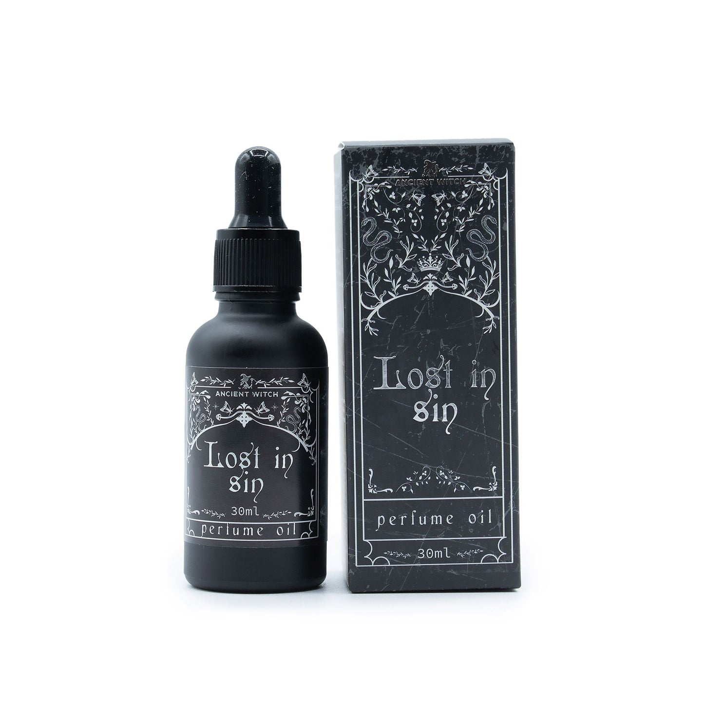 Black bottle and box of Ancient Witch Lost in Sin perfume oil.