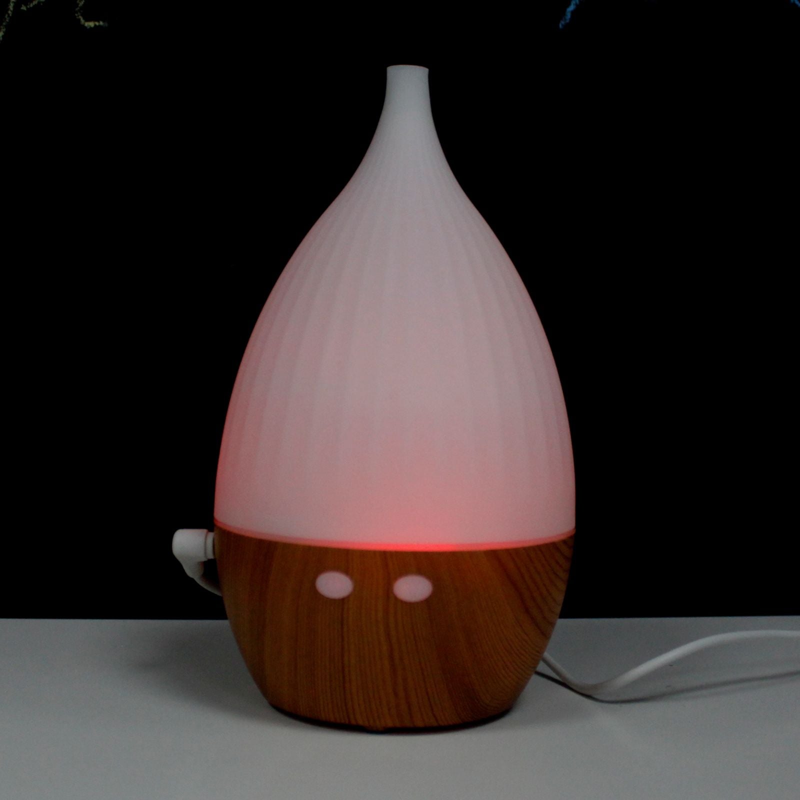 Milan Atomiser with wood-grain base and color-changing light.