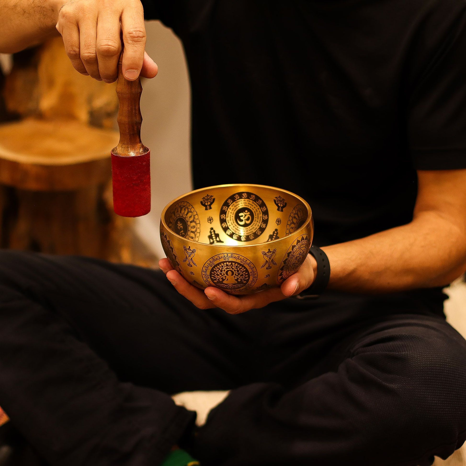 Set of 4 brass singing bowls with yogi engravings.