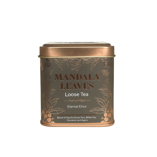 Eine graue Metalldose mit goldener Verzierung für Mandala Leaves Loose Tea.