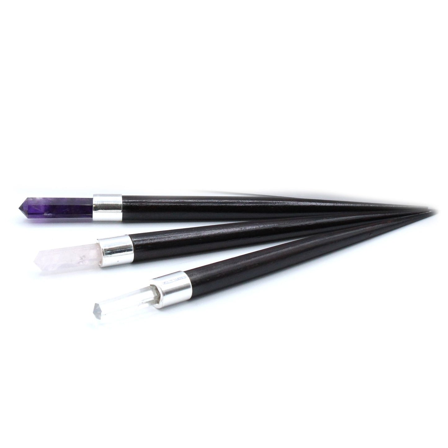 Three pointed crystal healing wands with dark wood handles and silver bands.