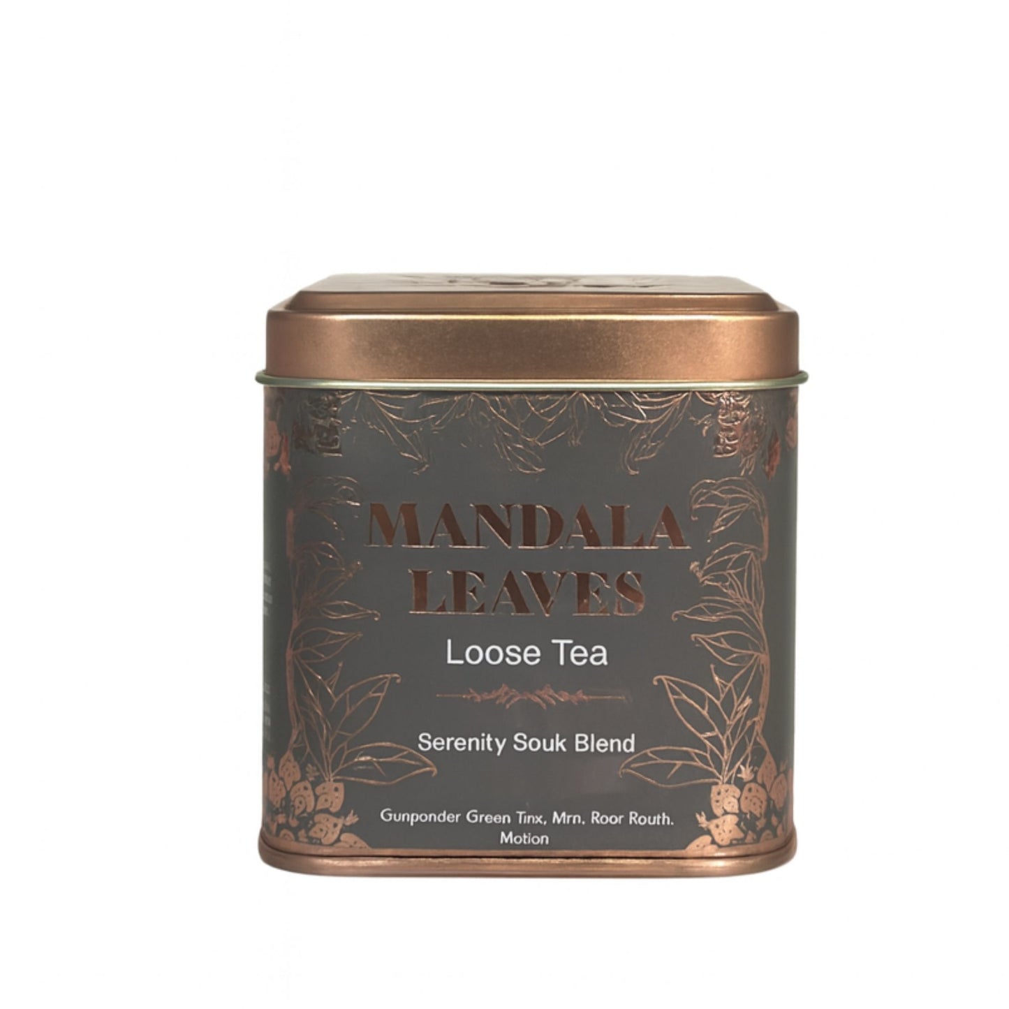 Eine graue Metalldose mit goldener Verzierung, die "Mandala Leaves Loose Tea" und "Serenity Souk Blend" anzeigt.