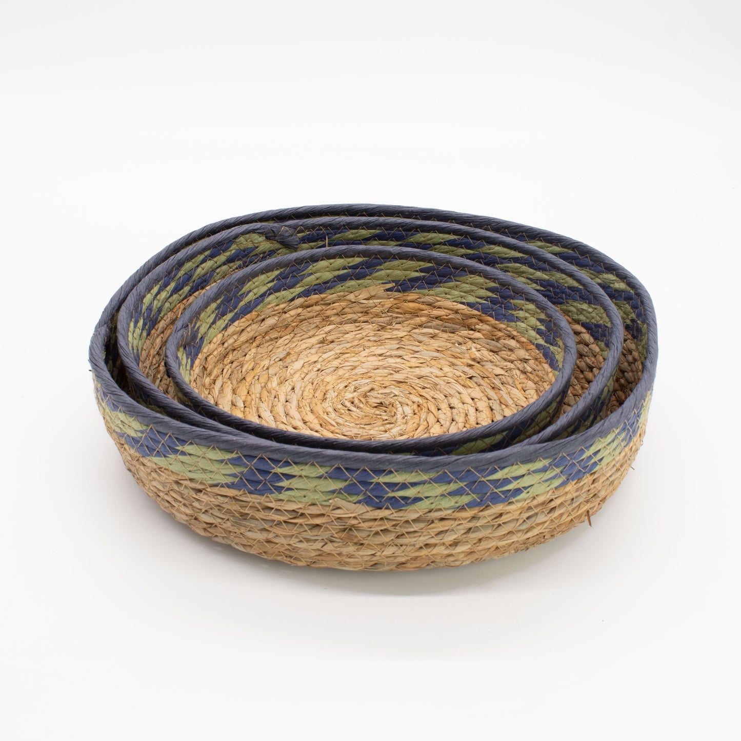 Set of 3 natural straw and seagrass tray baskets with green and blue detailing.