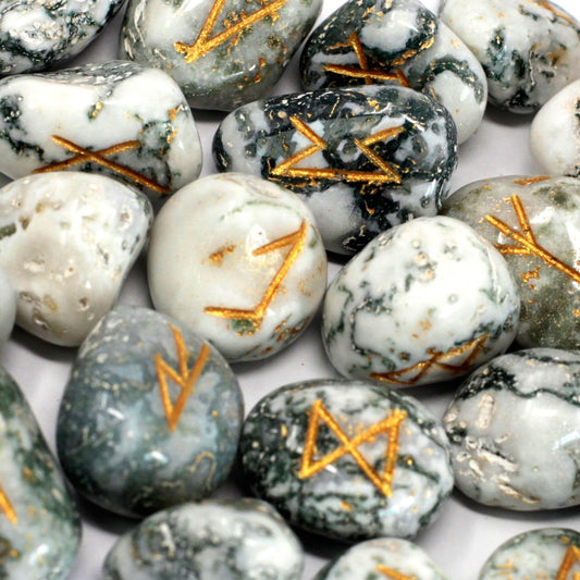 Tree agate rune stones with gold symbols.