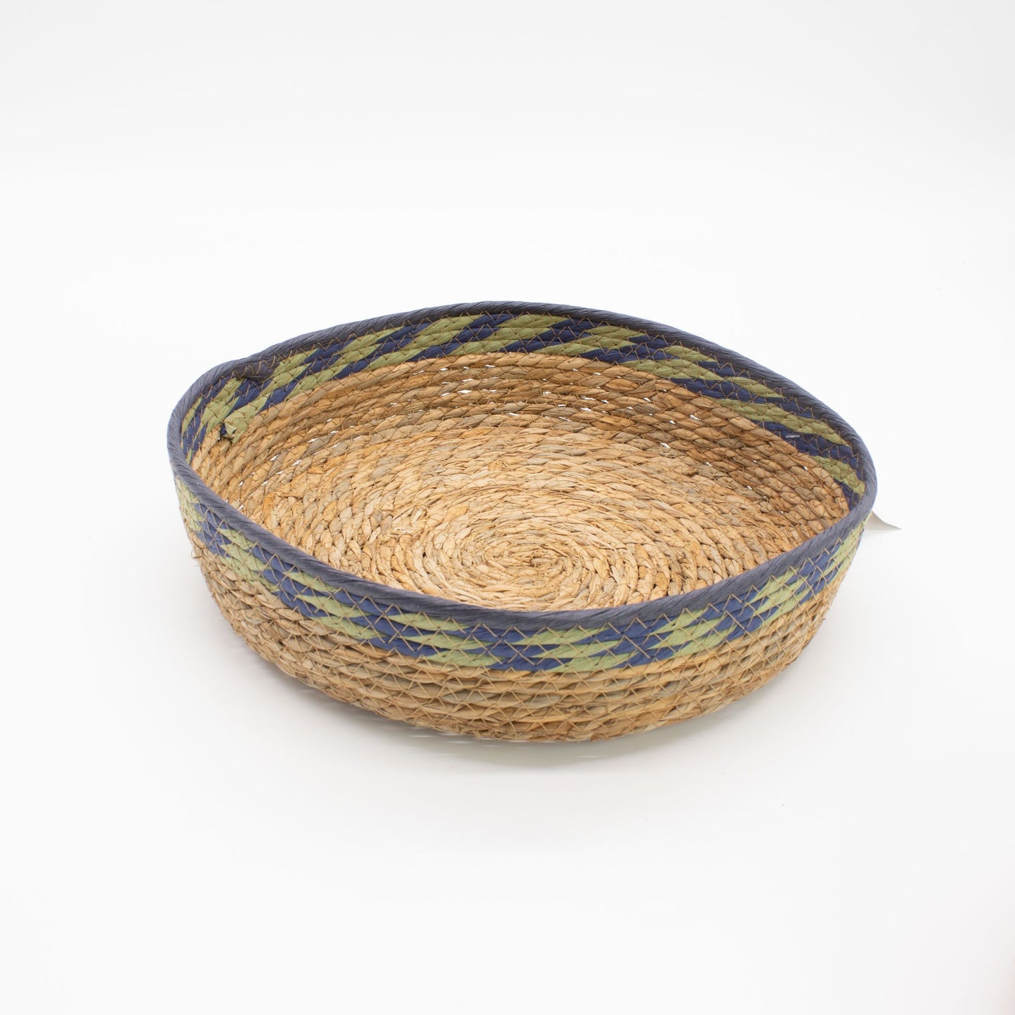 Round woven straw basket with blue and green trim.