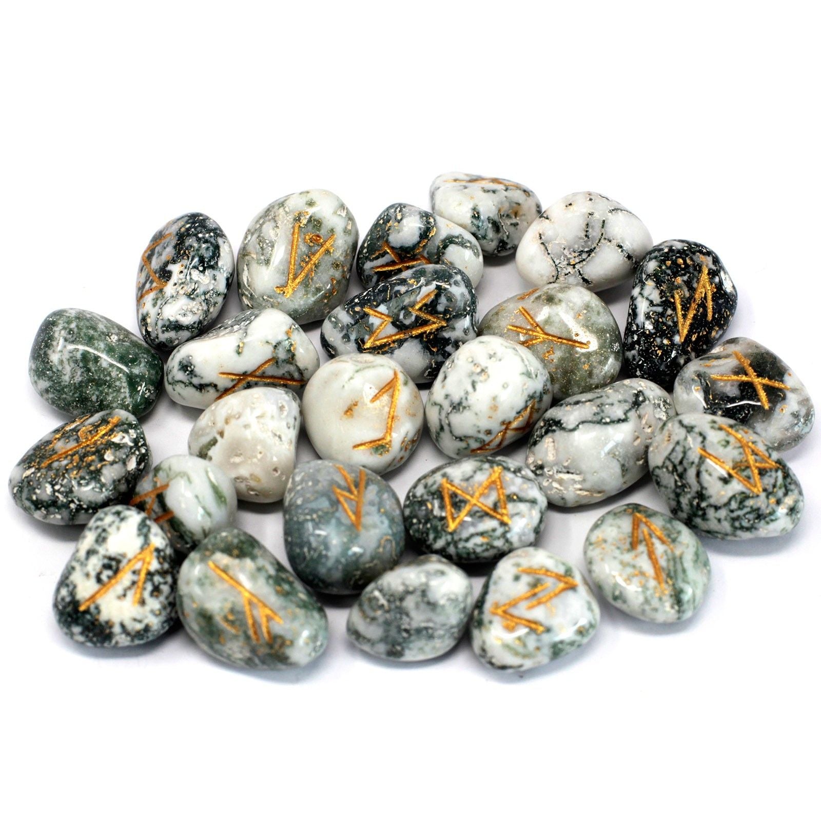A set of tree agate rune stones with gold symbols on a white background.