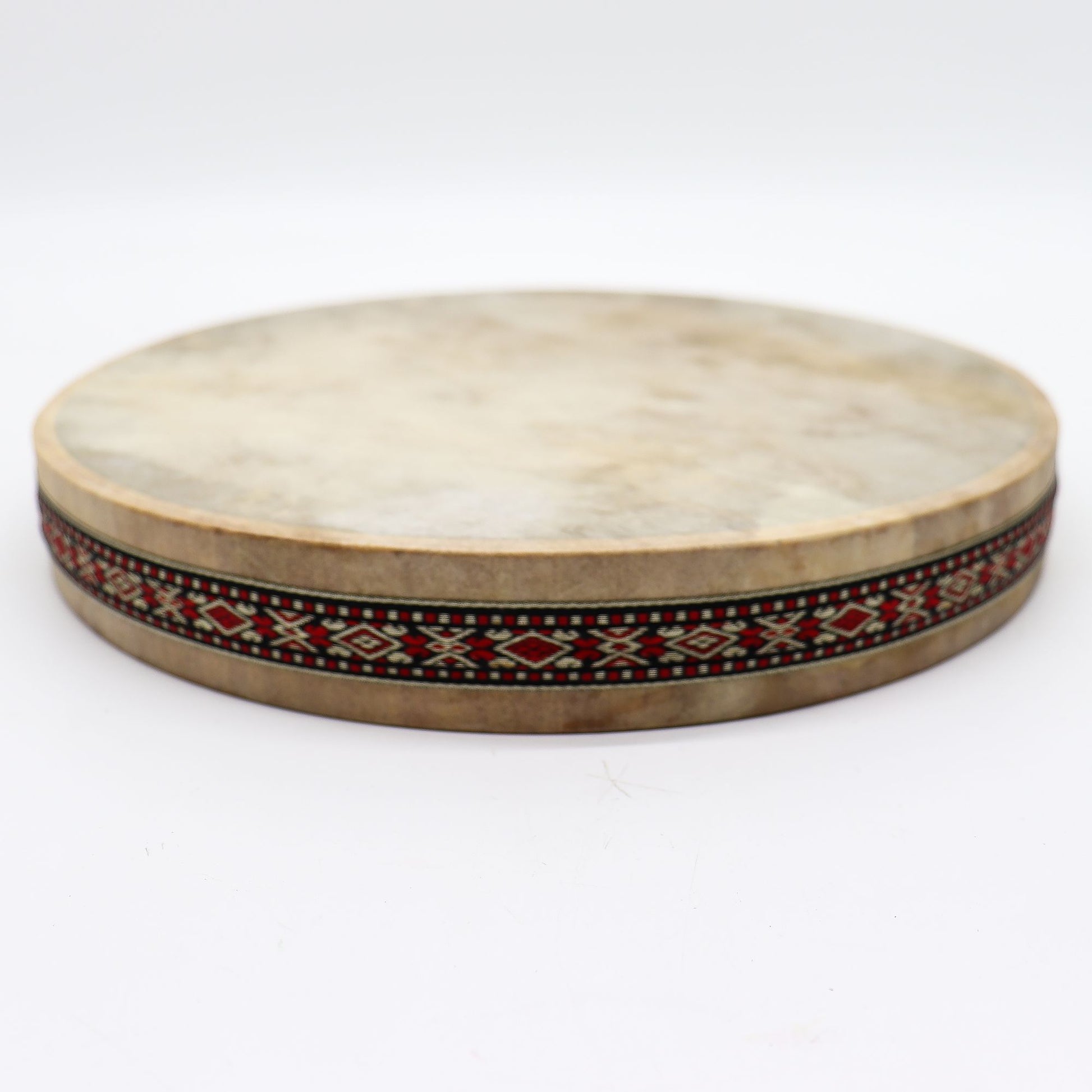 A 30cm shaman ocean drum with a goatskin head and decorative patterned frame.
