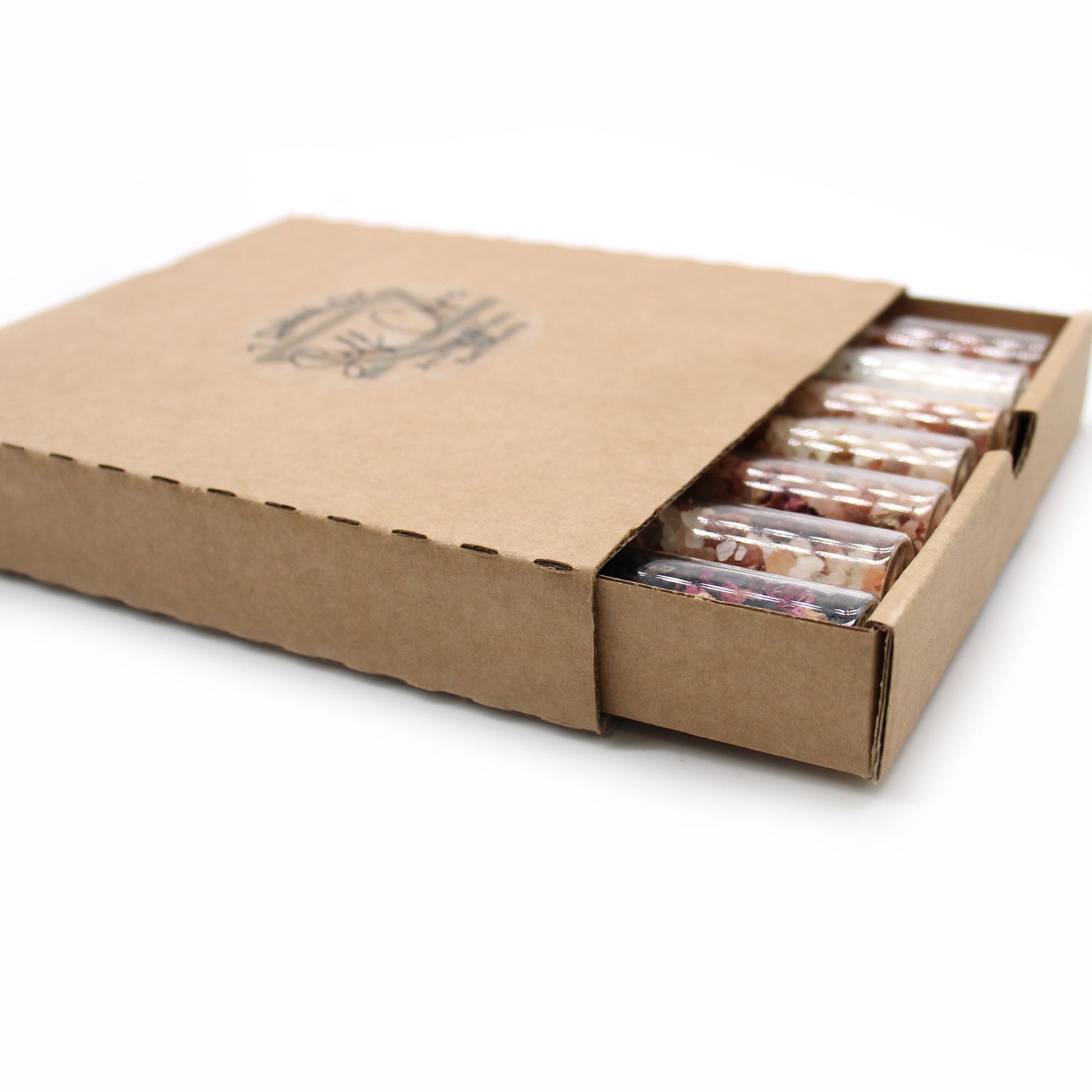Gift pack of 7 bath salt vials in a cardboard box.