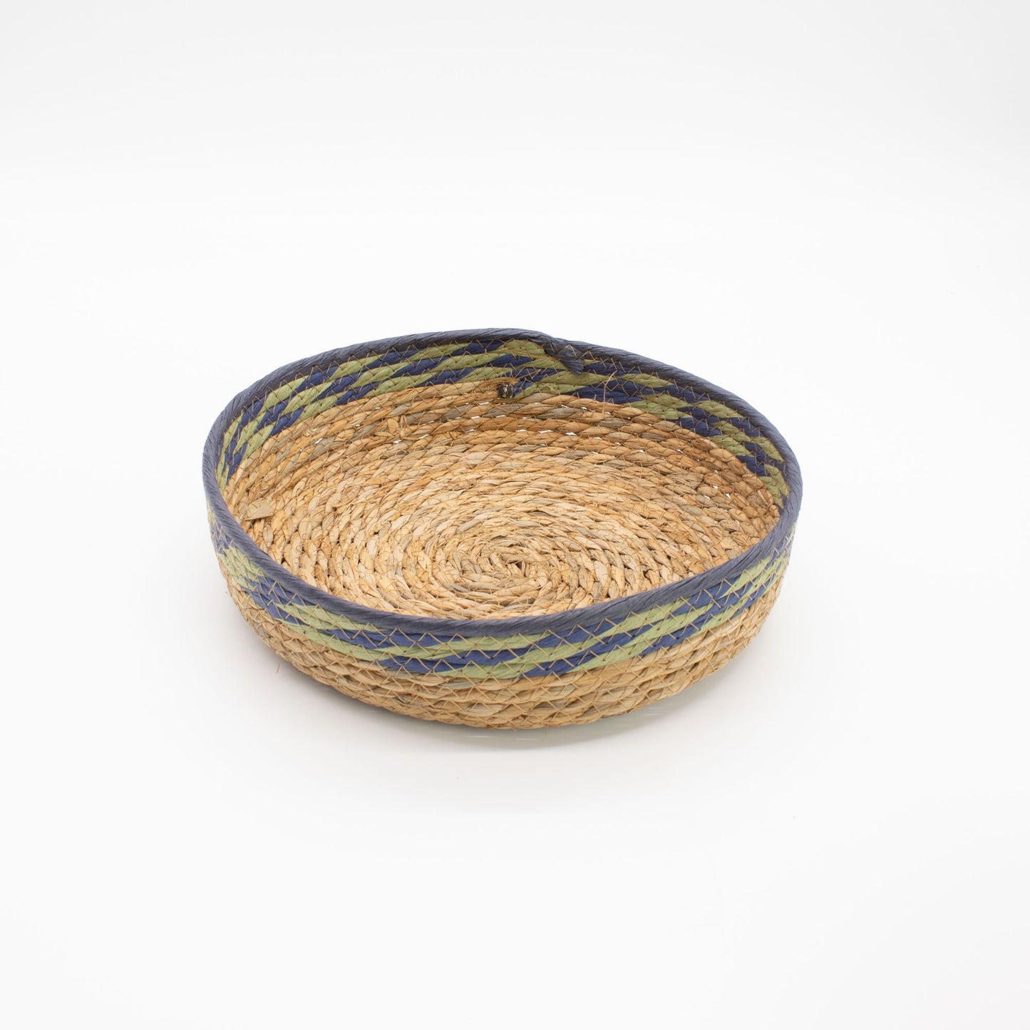Woven straw and seagrass tray basket with blue and green trim.