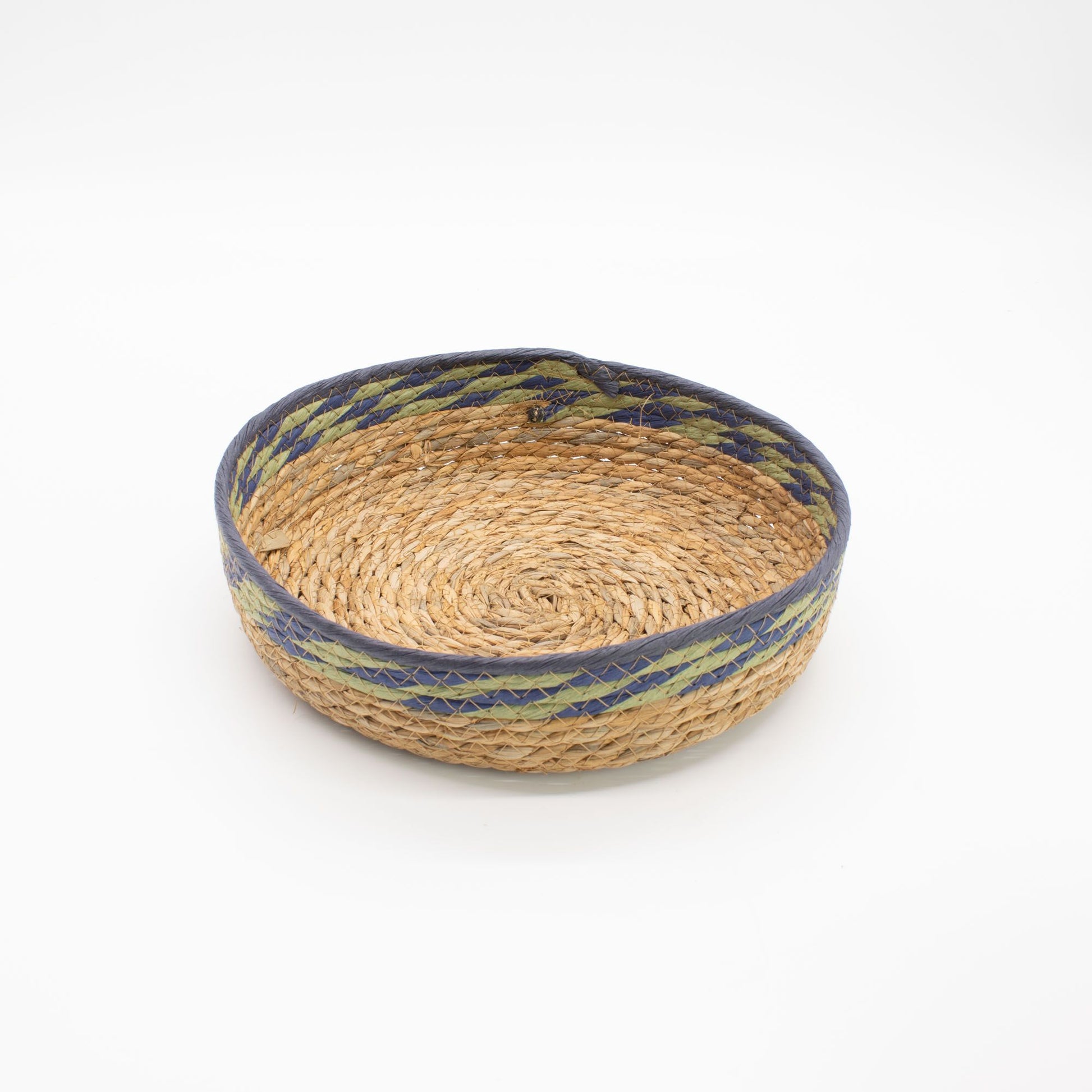 Woven straw and seagrass tray basket with blue and green trim.