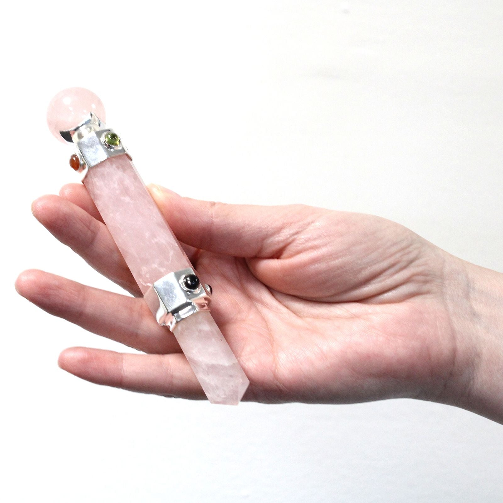 Hexagonal rose quartz healing wand with a sphere top and gemstone accents.