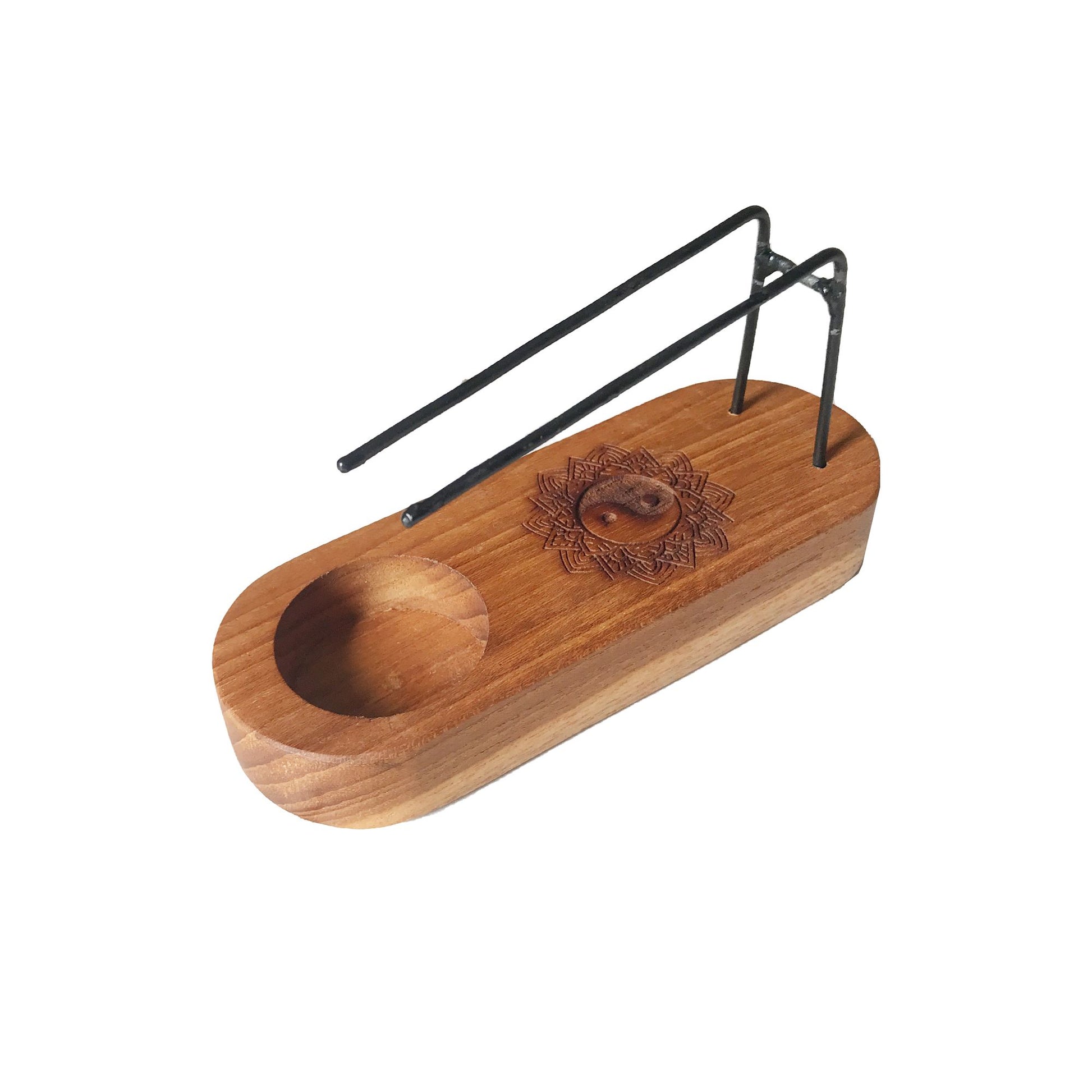 Small teak wood palo santo heater with yin and yang design.