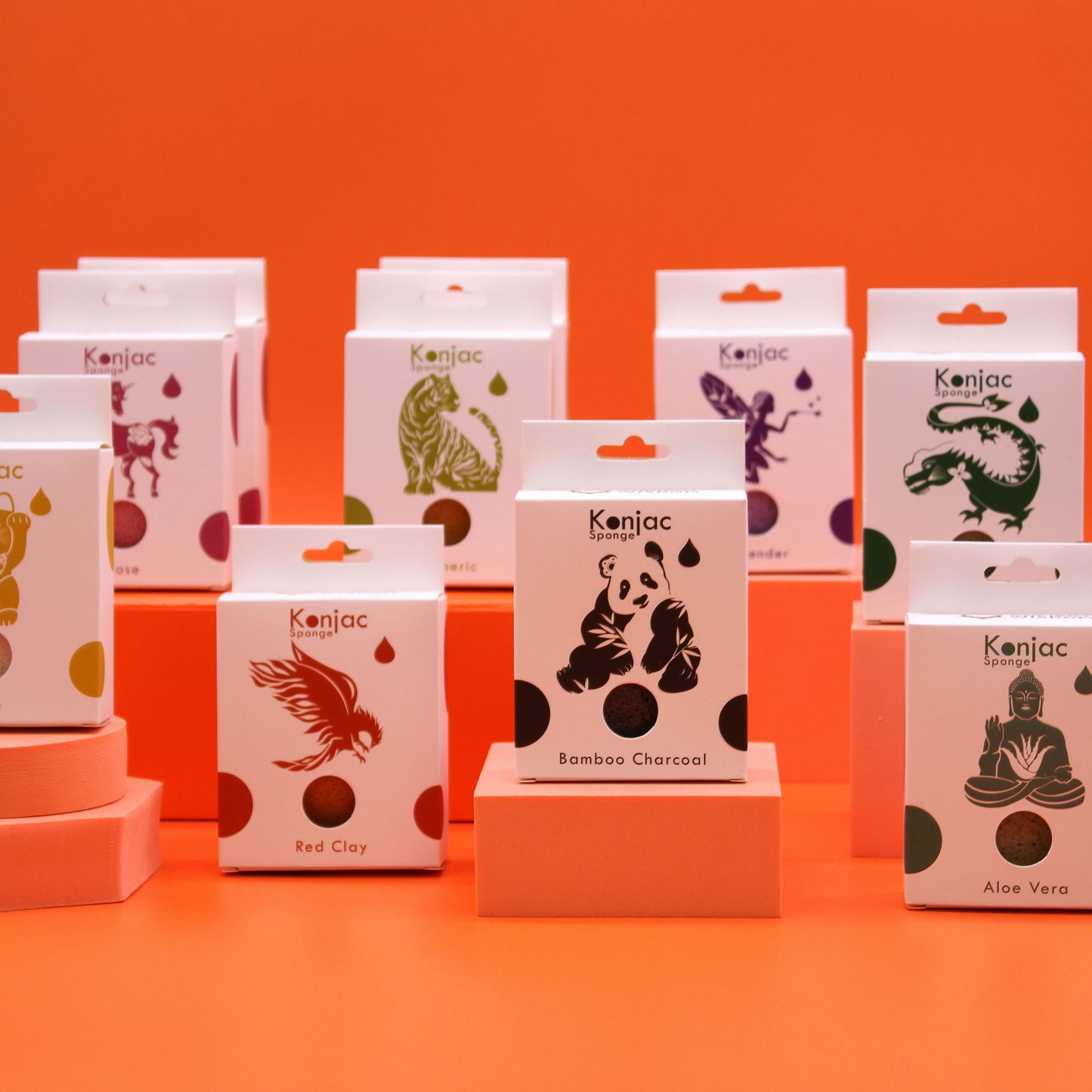 Konjac sponges with animal and figure designs on white boxes.