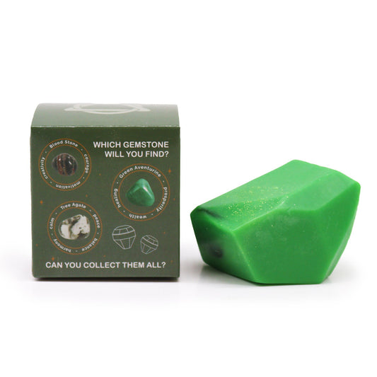 Green crystal elemental soap with a box showing different gemstones.
