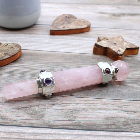 Hexagonal rose quartz healing wand with silver accents and amethyst stones.