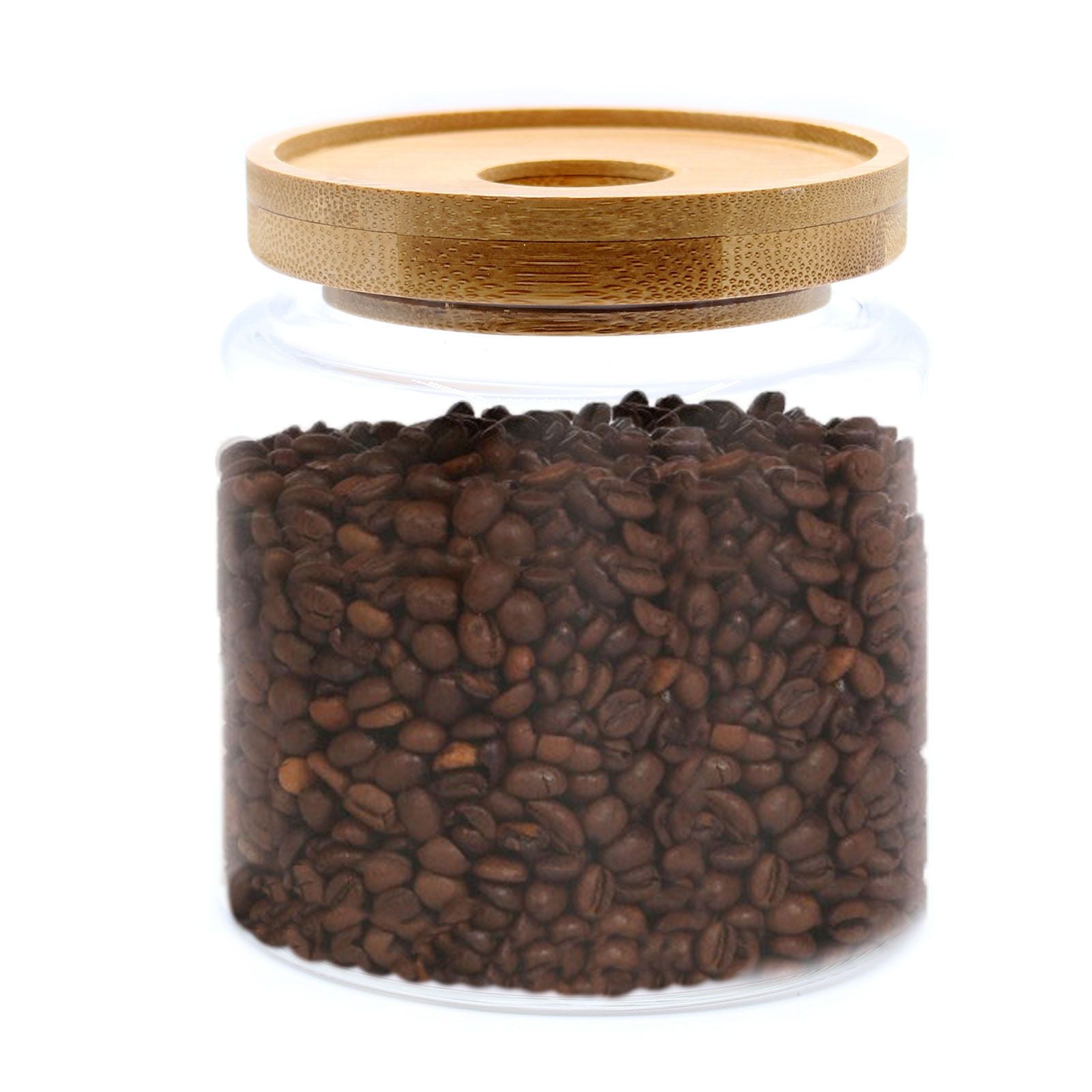 Vorratsglas aus Glas mit Bambusdeckel, gefüllt mit Kaffeebohnen.