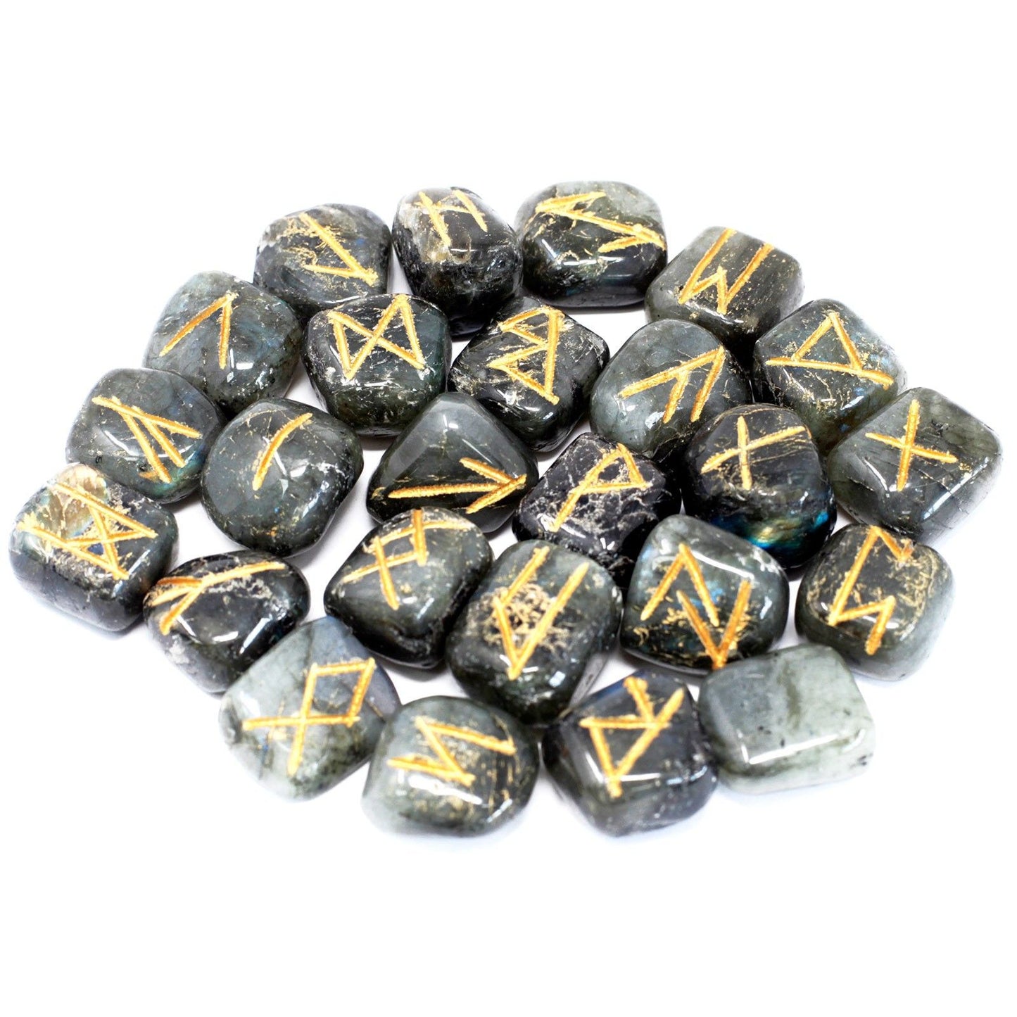 A pile of labradorite rune stones with gold symbols on a white background.