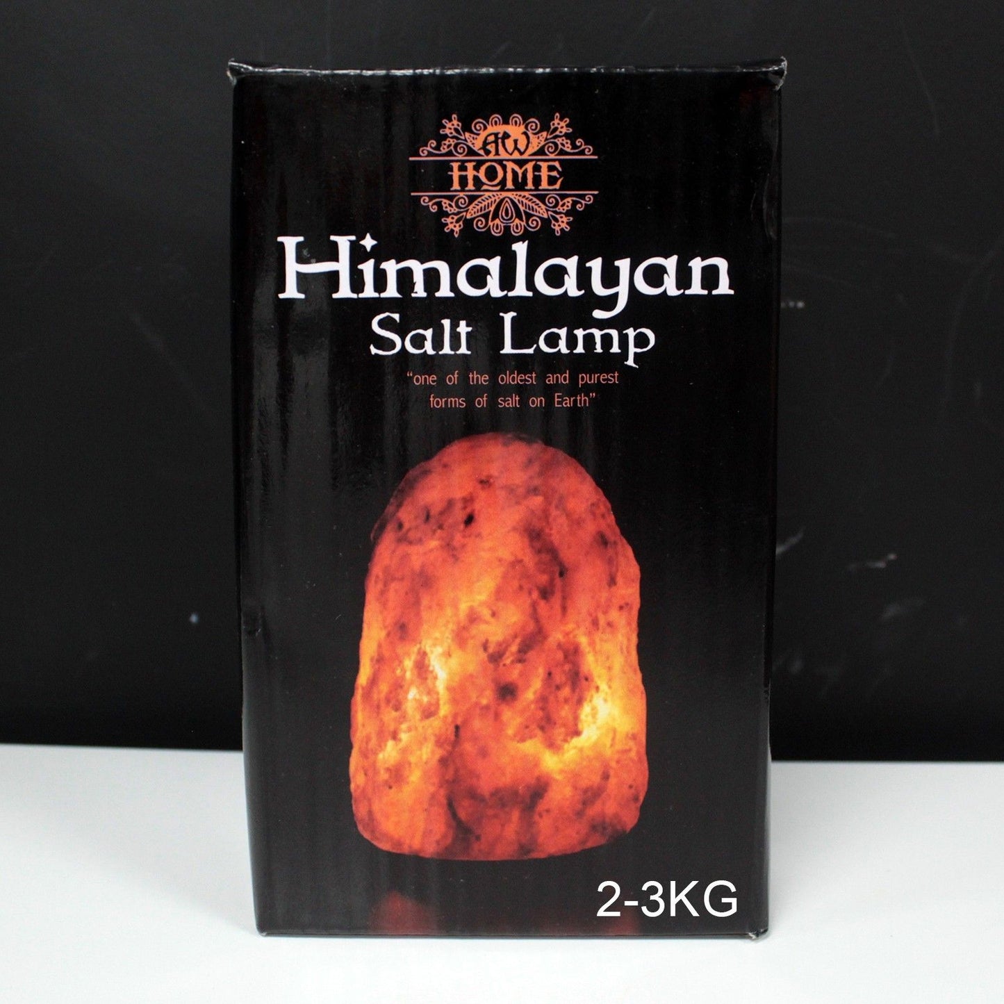 A natural Himalayan salt lamp with a rough texture, weighing 2-3kg.