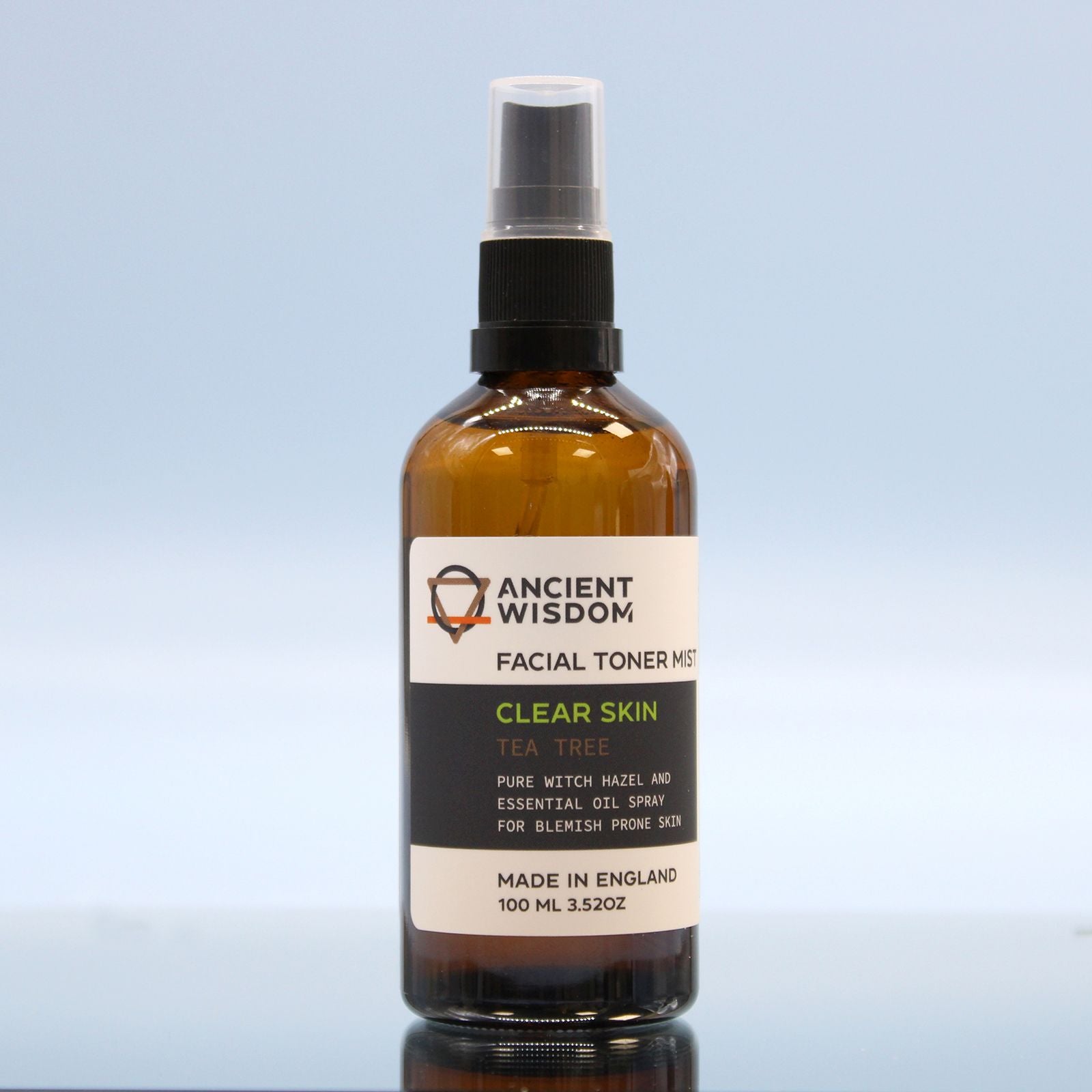 Amber glass bottle of Ancient Wisdom facial toner mist with a spray top.