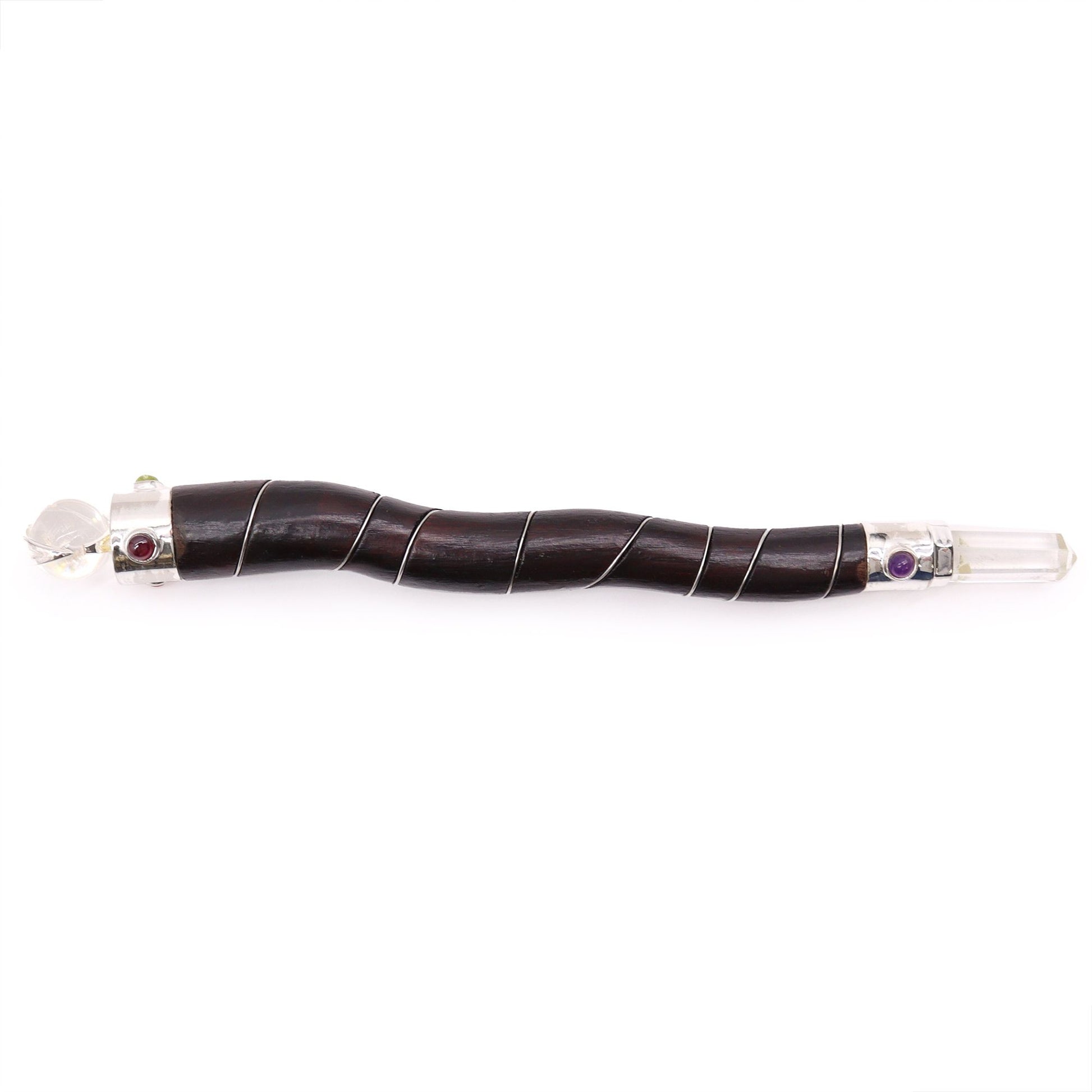 Natural curved wood wand with rock quartz crystals and small colorful gemstones.