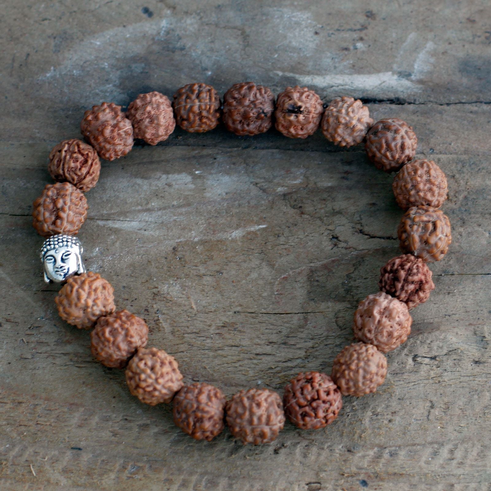 Brown Rudraksha bangle mala with a Buddha charm.
