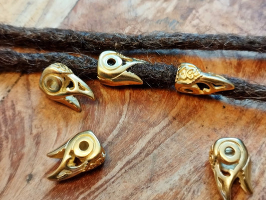 Viking-style dread beads with bird/raven head design made of stainless steel.