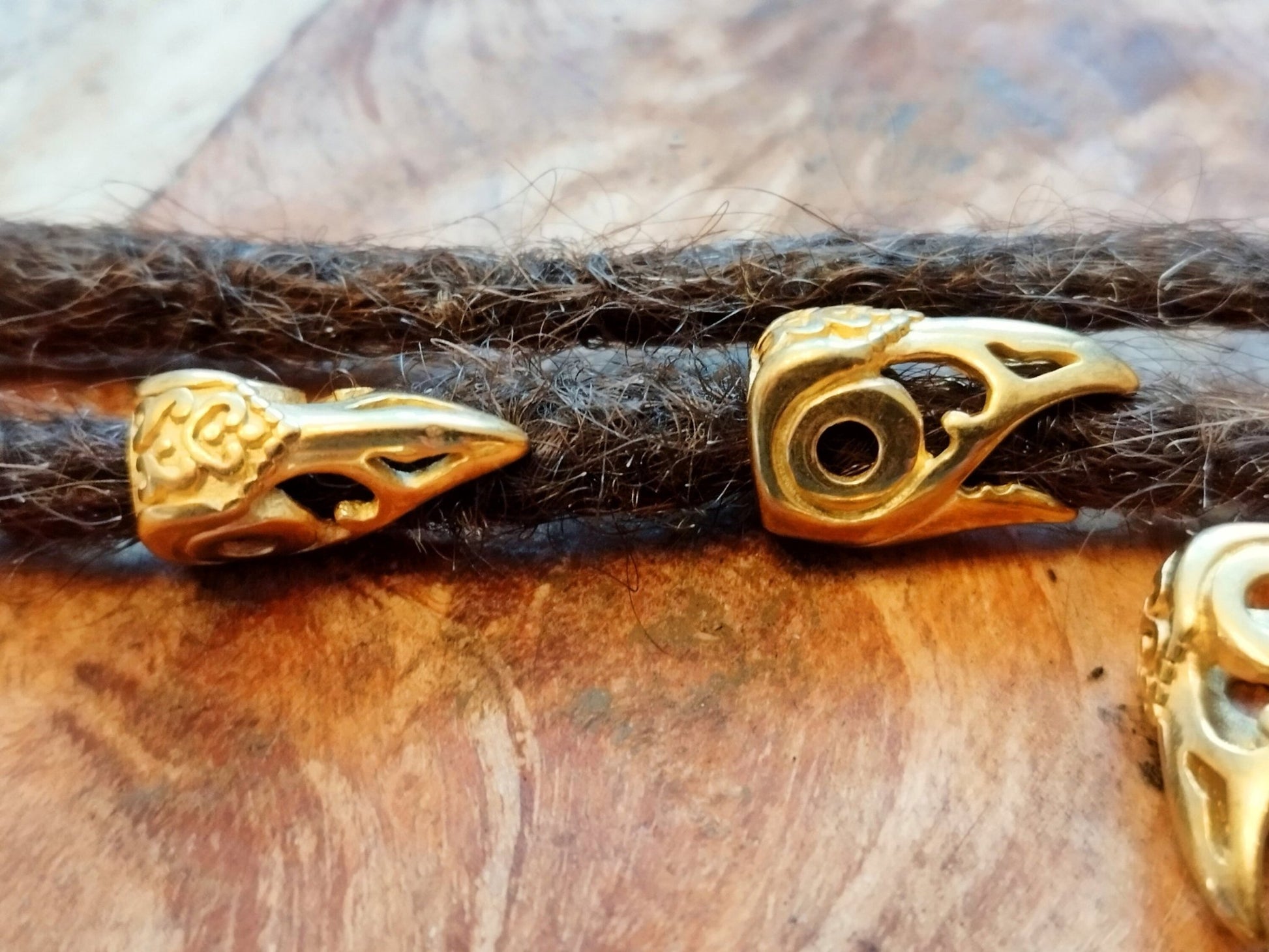 Viking style dread bead with bird/raven head design.